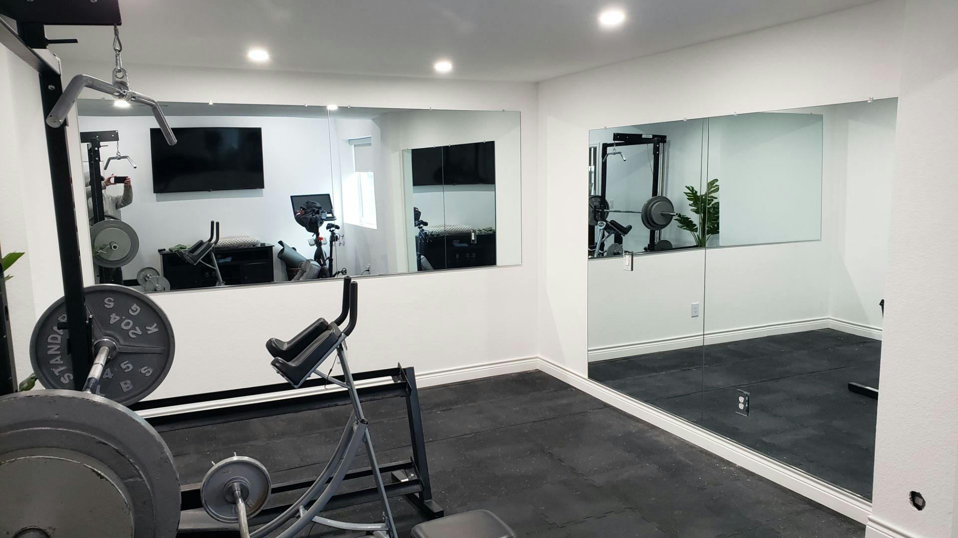 Custom-cut home gym mirror designed for tight spaces and low ceilings