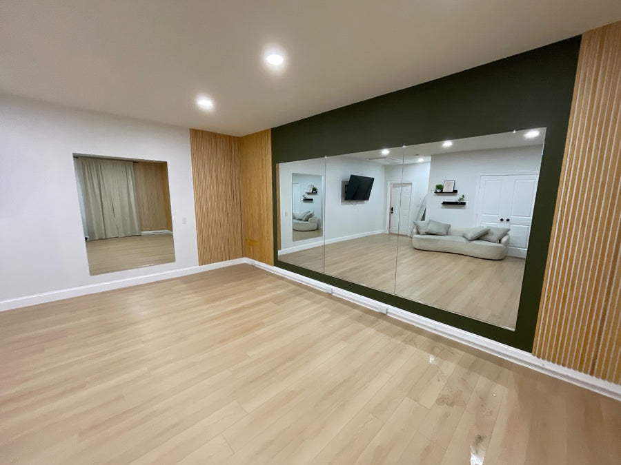 Garland Basement Gym Mirror Wall — mirror installation photo 1